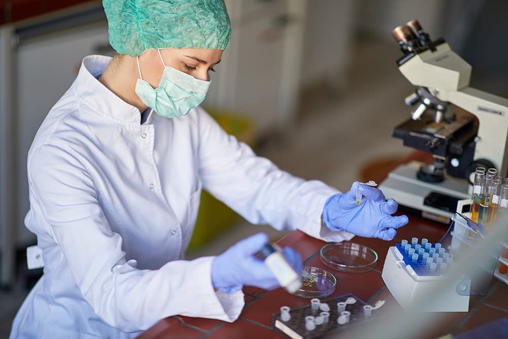 a scientist with a microscope
